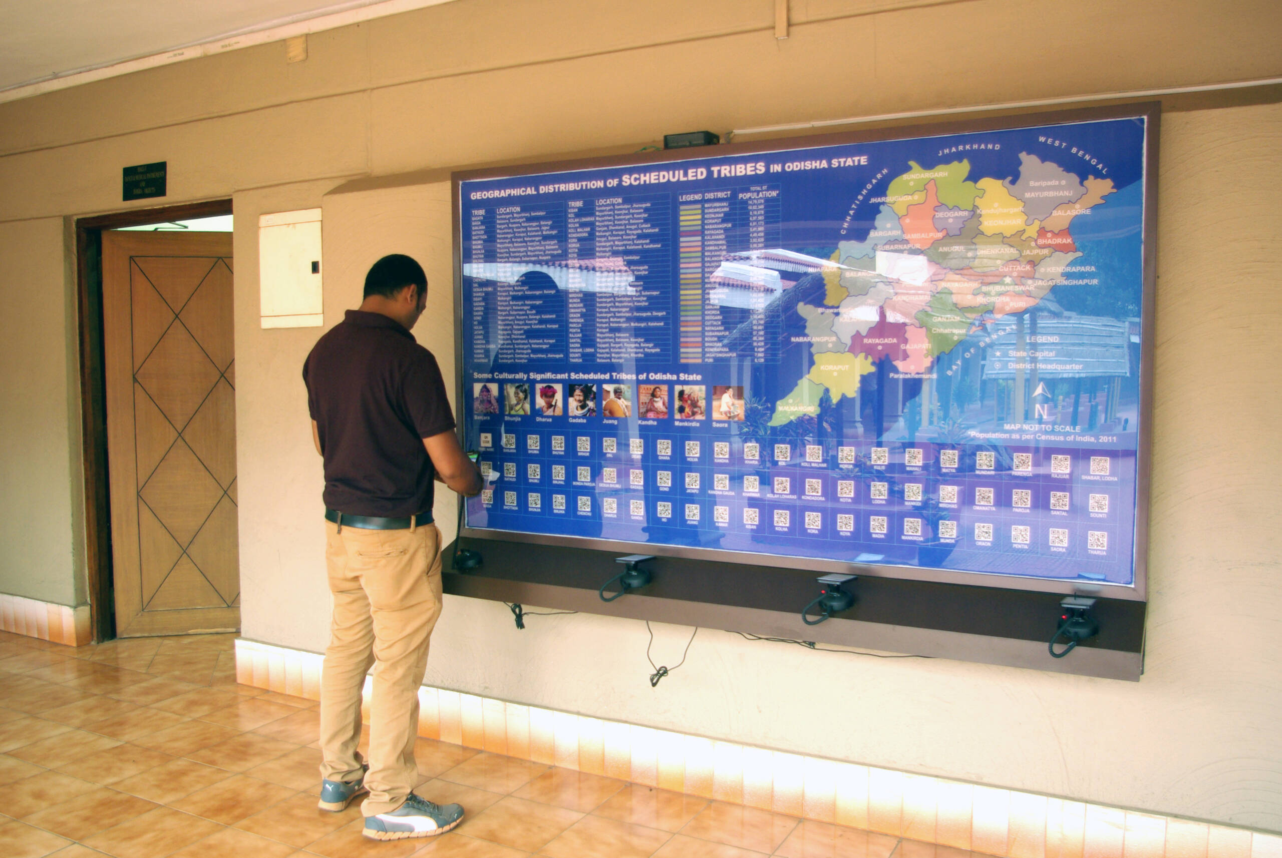 A visitors using QR code driven Interactive Map at Odisha State Tribal Museum
