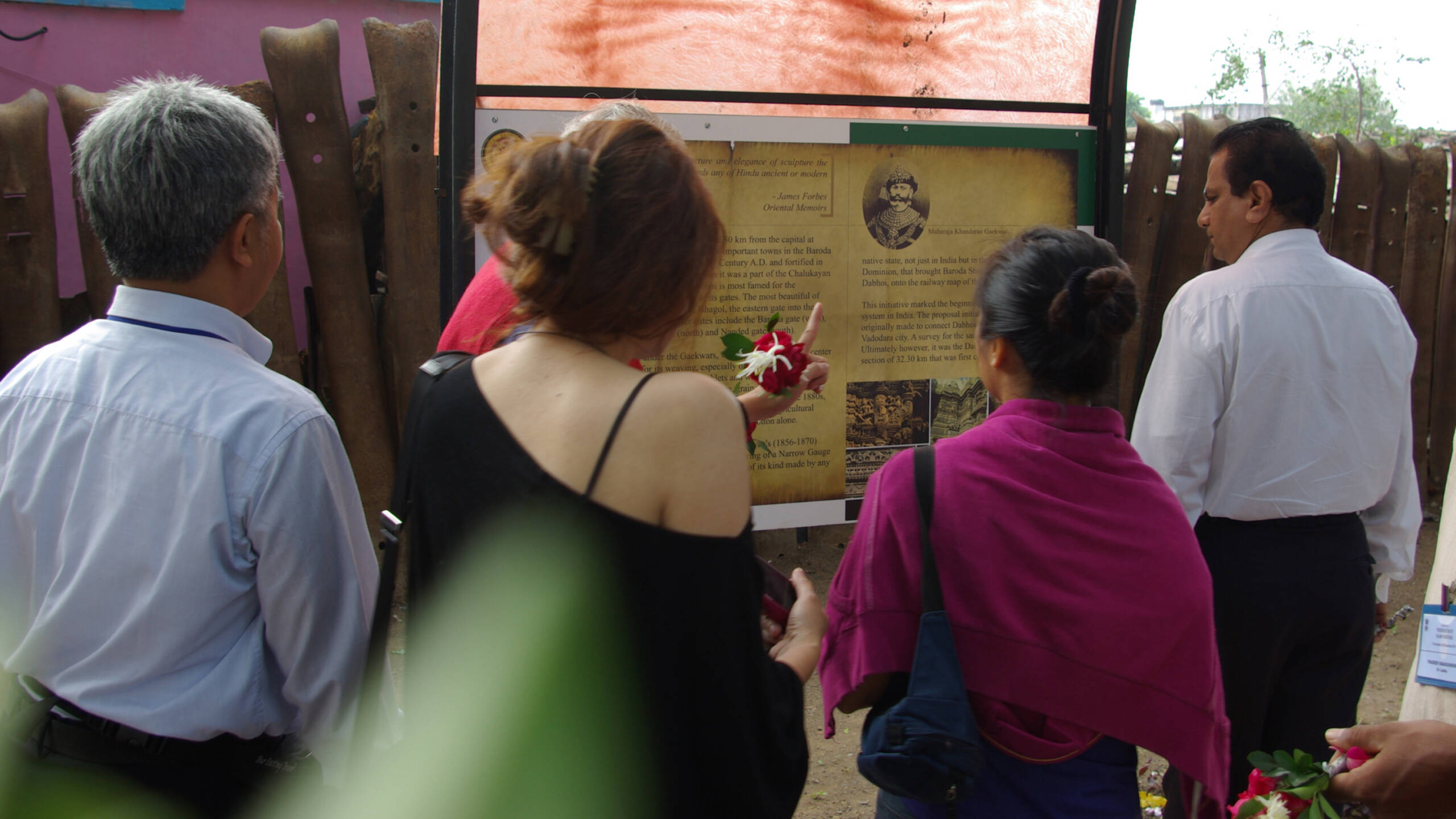 Visitors reading Interpretation Panel at Railway Heritage Park, Dabhoi