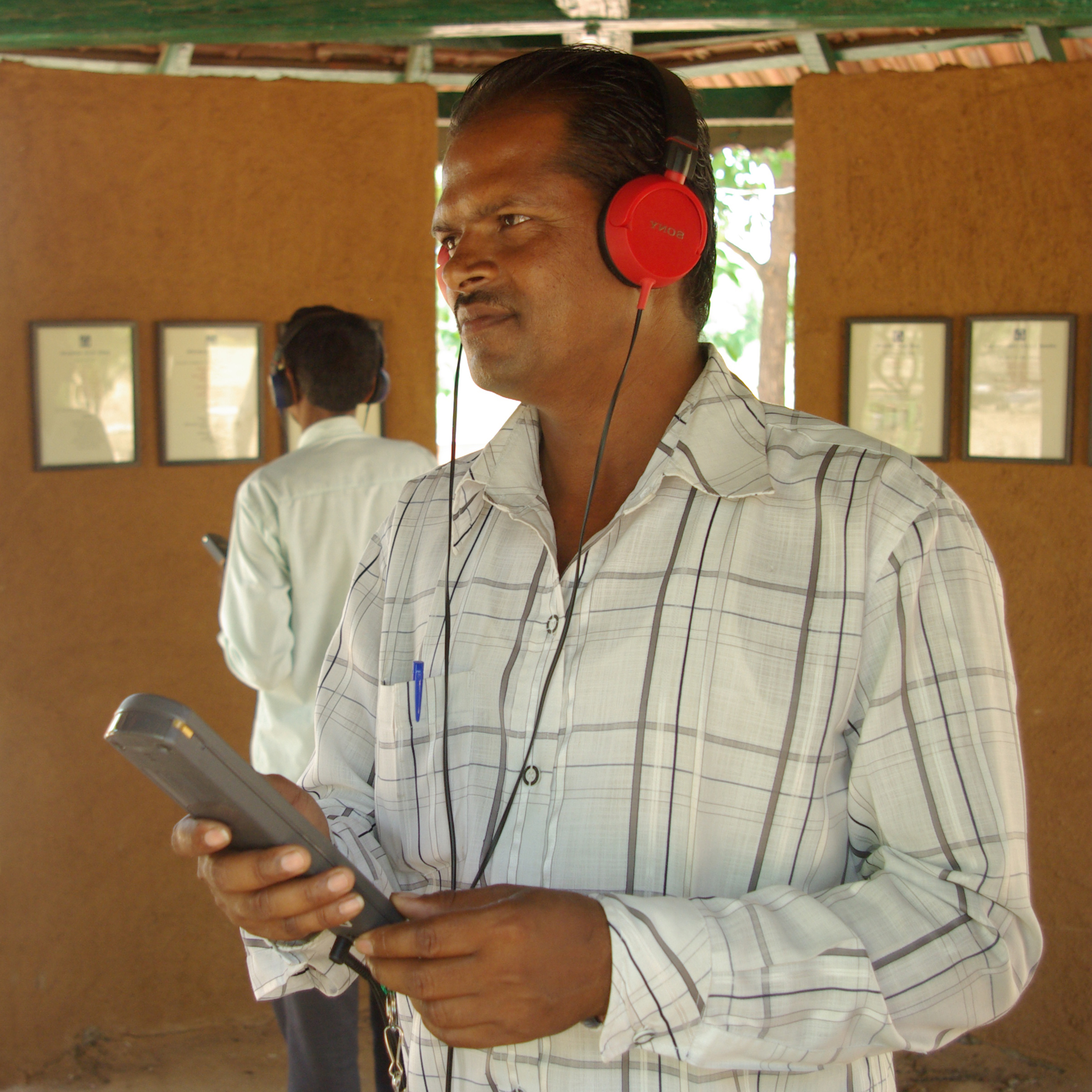 Visitors with audio guides at Bhasha Van